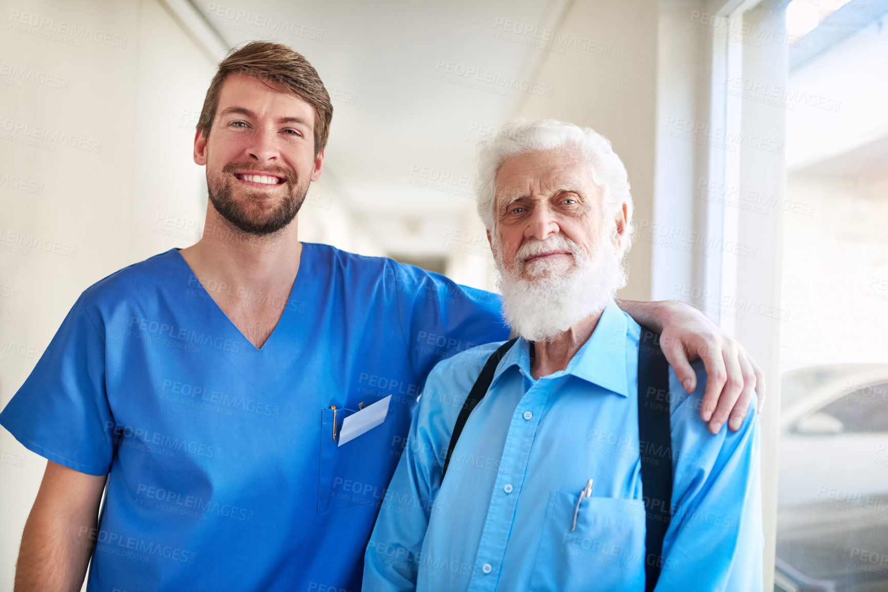 Buy stock photo Healthcare, homecare and face of caregiver with senior man in a hallway with happy, hug or bonding. Support, portrait and nurse embrace old patient with service, recovery or physical therapy progress