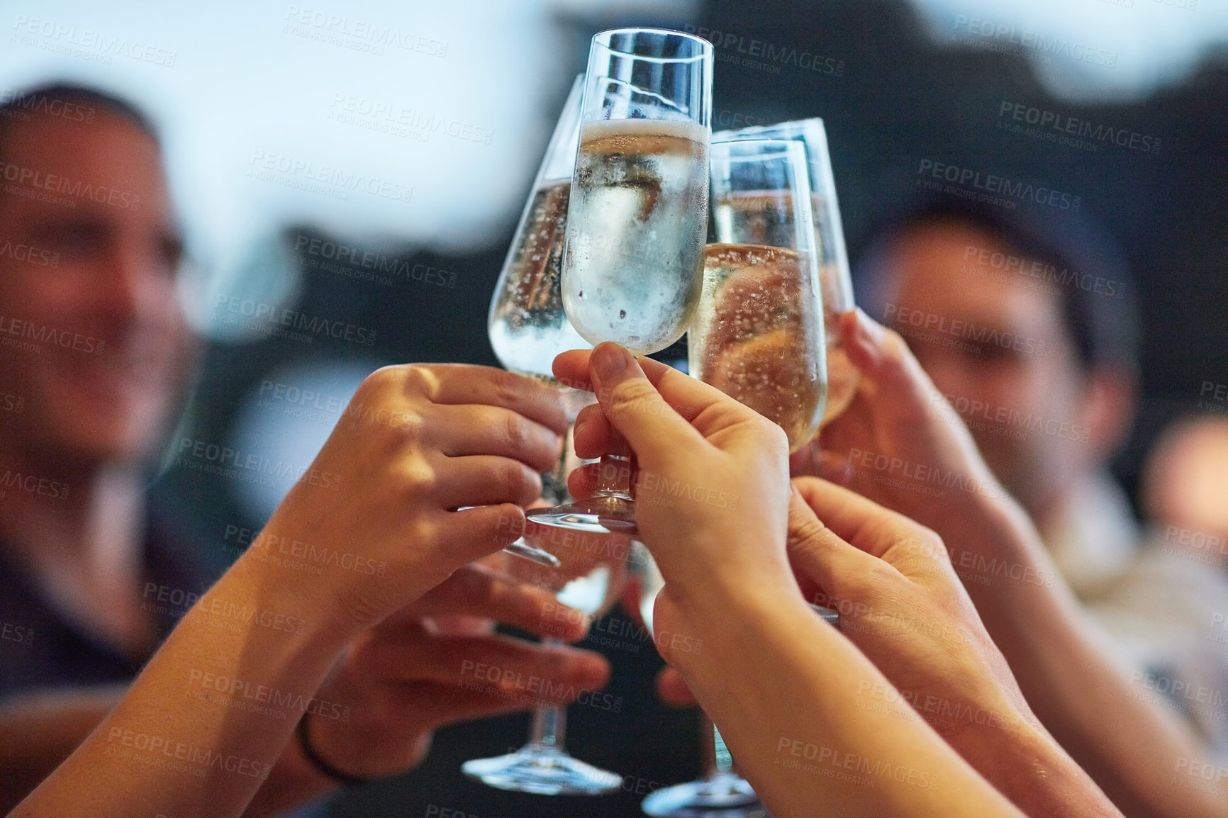 Buy stock photo Alcohol, hands and toast with friends outdoor for celebration or social gathering together closeup. Bubbles, champagne and festive cheers with group of people cheering for milestone or new years