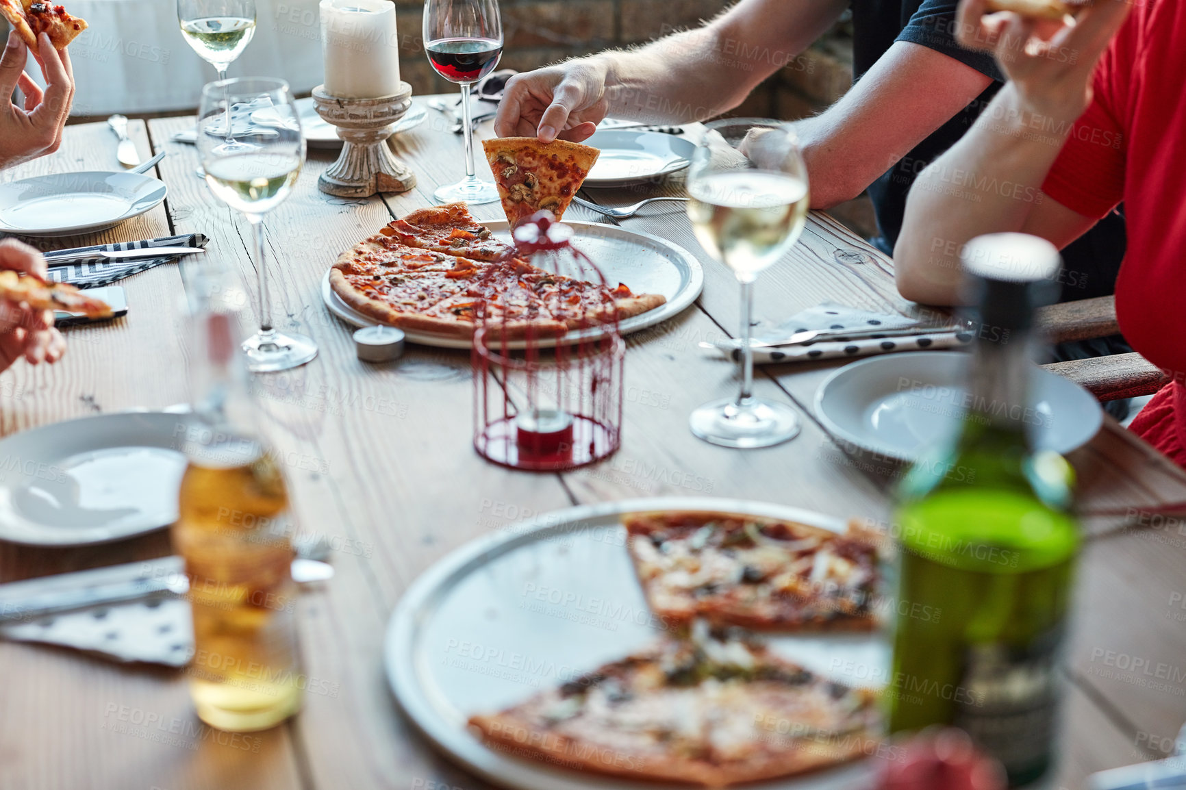 Buy stock photo Friends, pizza and drinks at restaurant on table for brunch, birthday and celebration as outdoor event. Group of people, food and beer or wine at city pub for lunch, party and social reunion in Italy