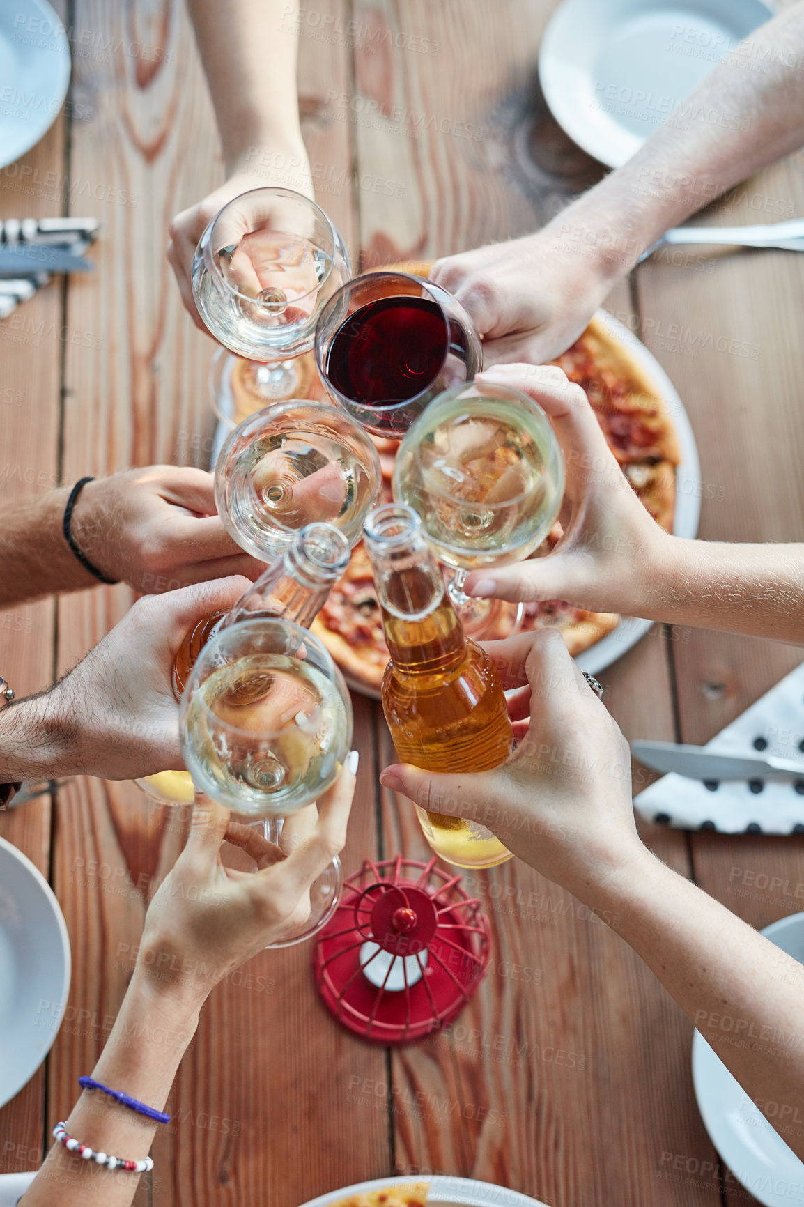 Buy stock photo People, drinks and cheers for celebration, food and brunch with friends in top view at restaurant. Reunion, bottle and glass as group, hands and social for support, party and event with pizza