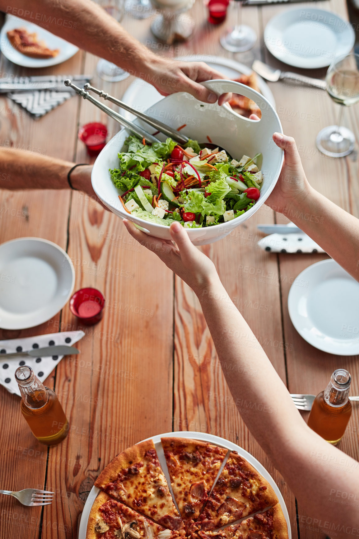 Buy stock photo Hands, salad and drinks at restaurant on table for brunch, birthday and celebration as outdoor event. Group of people, pizza and beer or wine at city pub for lunch, party and social reunion in Italy