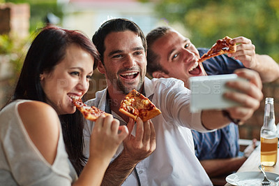 Buy stock photo Shot of a group of happy young friends posing for a selfie together at a backyard dinner party