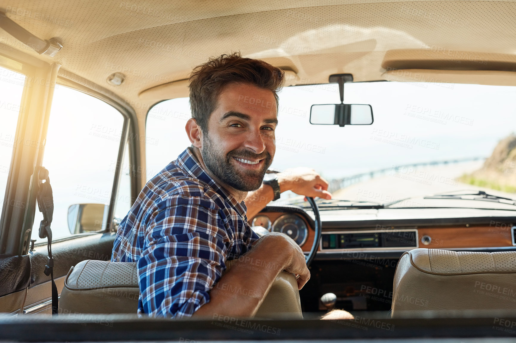 Buy stock photo Rearview portrait of a handsome man enjoying a summer road trip