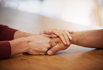 Buy stock photo Cropped shot of an unidentifiable young woman holding her friend's hand in support in a coffee shop