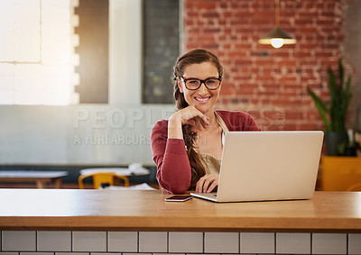Buy stock photo Portrait of a happy young business owner doing admin at a table in her coffee shop