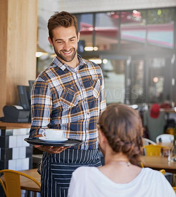 Buy stock photo Shot of a happy young waiter serving coffee to an unidentifiable woman in a coffee shop