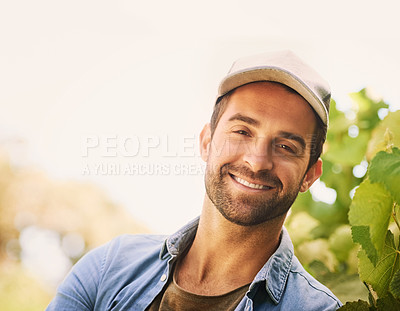 Buy stock photo Portrait of a cheerful young farmer posing in the fields on his farm