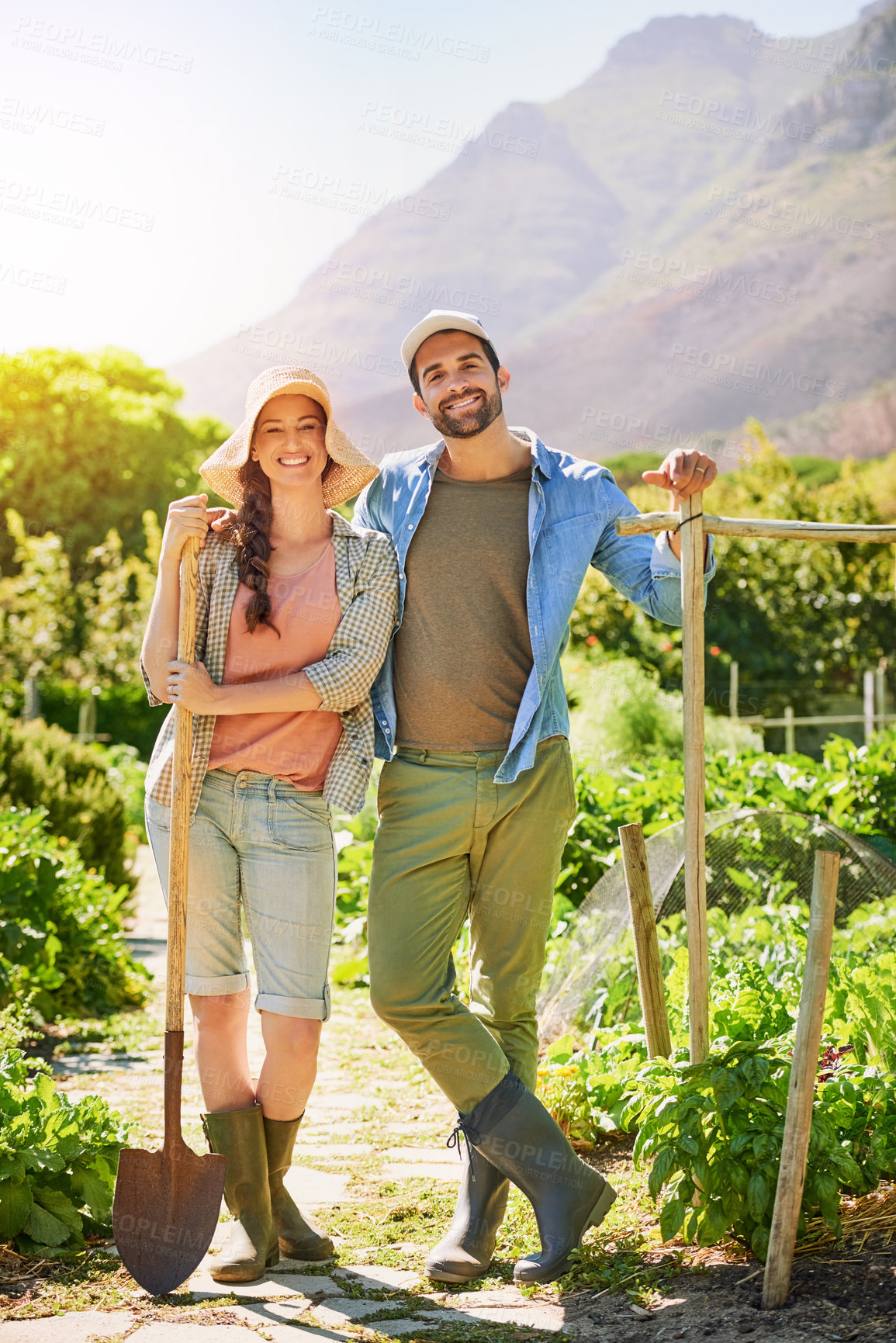 Buy stock photo Portrait of two happy young farmers posing together  in the fields on their farm