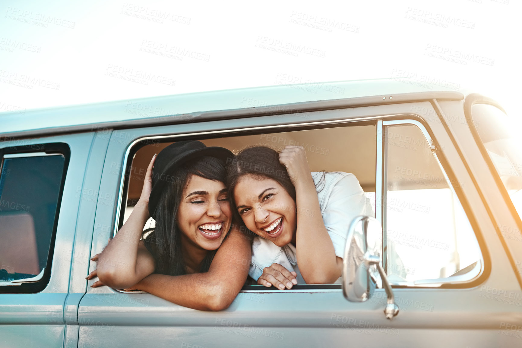 Buy stock photo Women, friends and happy by window, car and road trip with portrait, excited and adventure on holiday. People, travel and transportation with vehicle on highway with laughing on vacation in Mexico