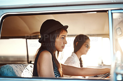 Buy stock photo Shot of two young women going on a road trip