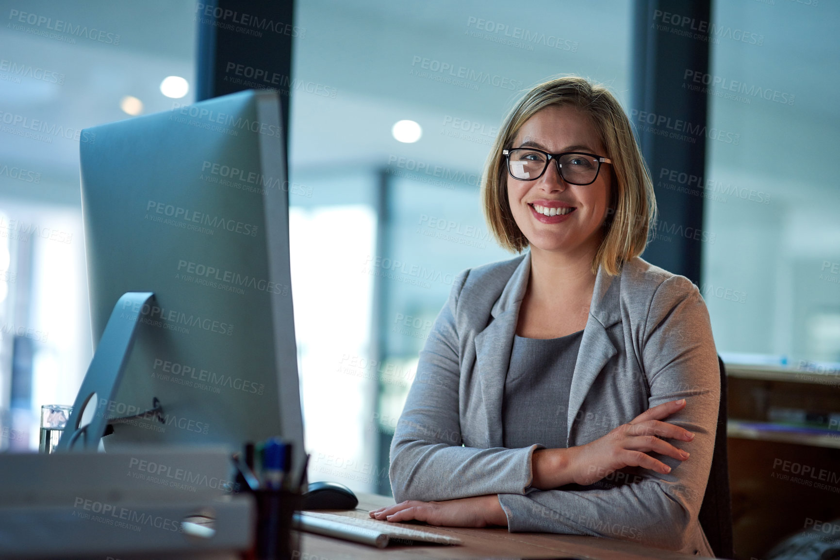 Buy stock photo Professional, lawyer or woman in portrait with computer, case research and confidence with smile. Office, female attorney and desktop for corporate firm, legal service and labor law employee at night