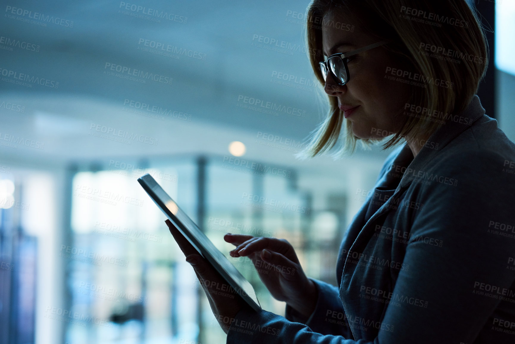 Buy stock photo Tablet, thinking and business woman at night for reading email, planning and working in office. Professional, typing and receptionist for administration, research deadline and digital information