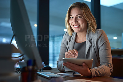Buy stock photo Cropped portrait of a businesswoman working on a digital tablet in her office late into the night