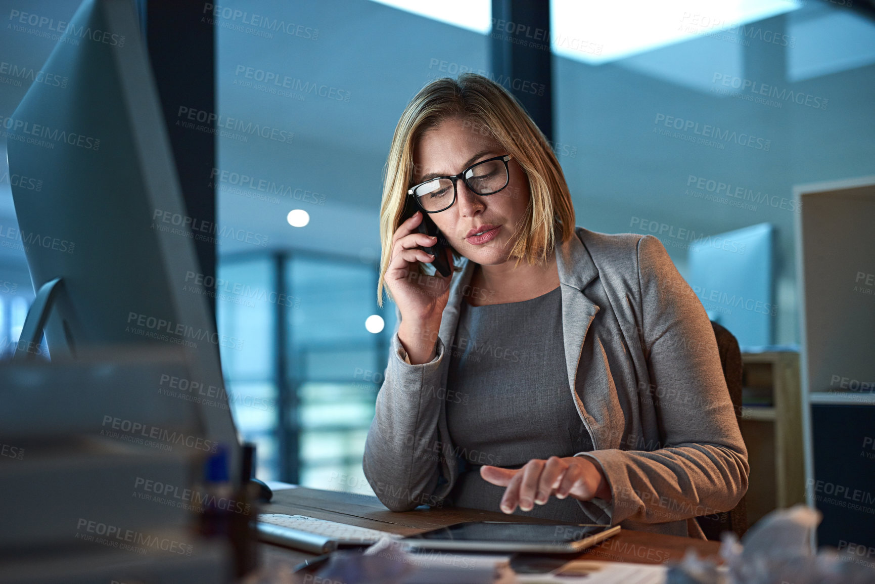 Buy stock photo Cropped shot of a businesswoman working late in the office