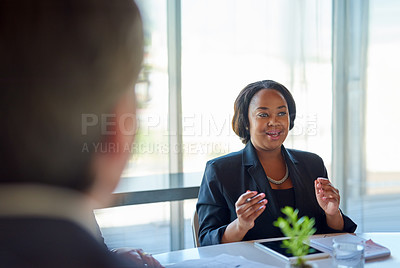 Buy stock photo Shot of business people having a discussion in a modern office