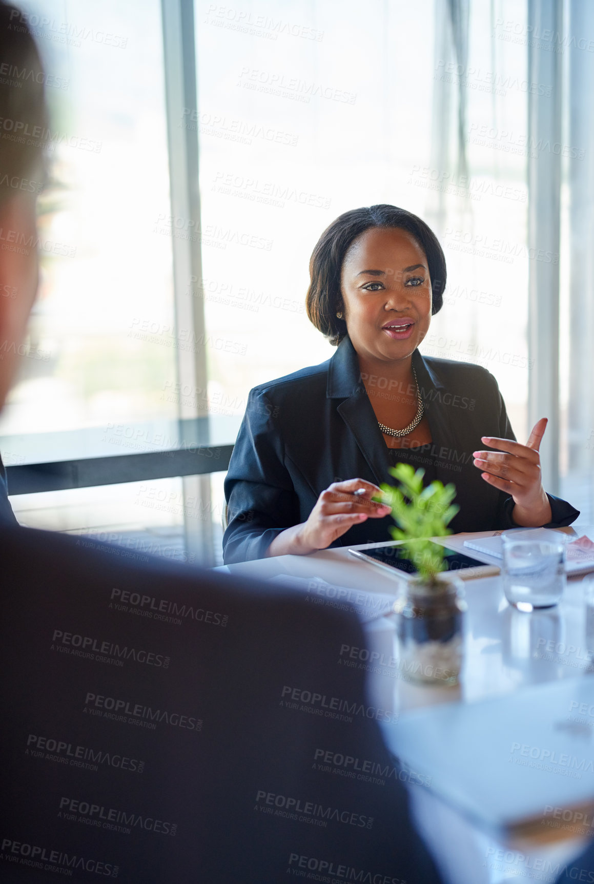 Buy stock photo Meeting, hiring and business woman with candidates in office for recruitment discussion. Interview, conversation and female hr manager talk to people for onboarding process in workplace boardroom.