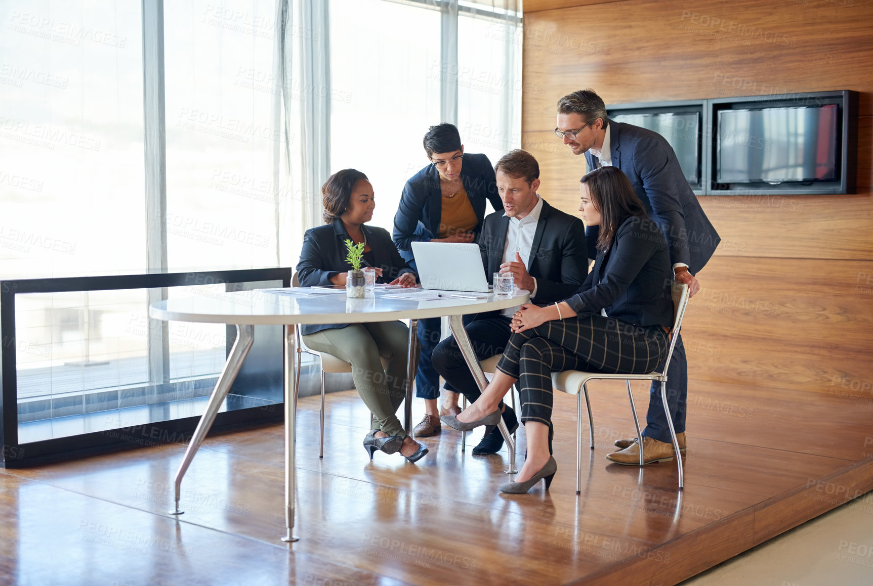 Buy stock photo Discussion, collaboration and team in a meeting with laptop for corporate planning in the office. Teamwork, technology and group of professional employees working on project together in the workplace