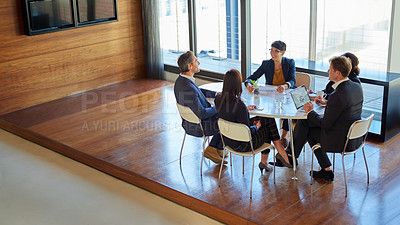 Buy stock photo Professional, group and meeting for a discussion or collaboration at a company with a plan. Teamwork, conversation and strategy  at a table for a project or partnership with tech at the office.