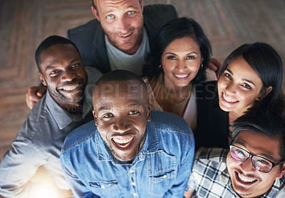 Buy stock photo High angle portrait of a confident group of creative colleagues posing together in their office