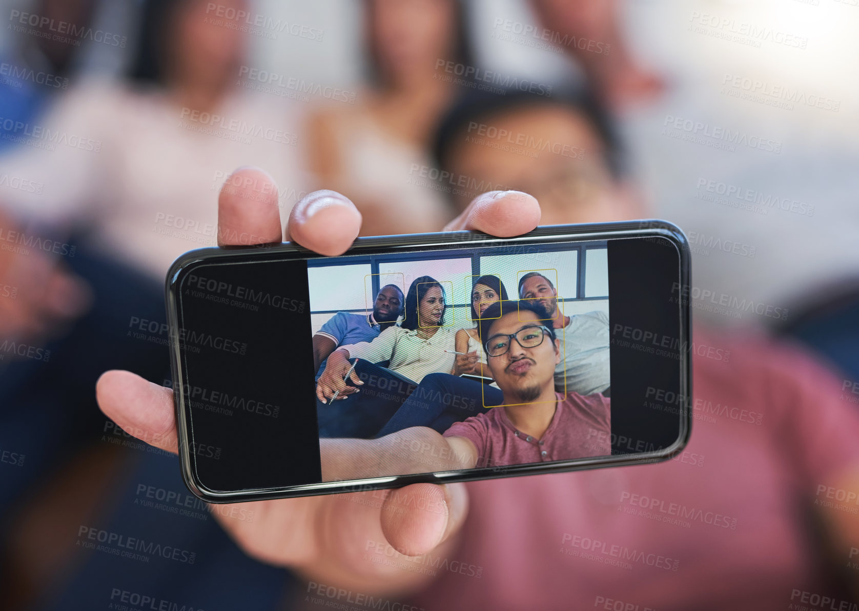 Buy stock photo Shot of a happy group of creative colleagues posing for a selfie together in the office