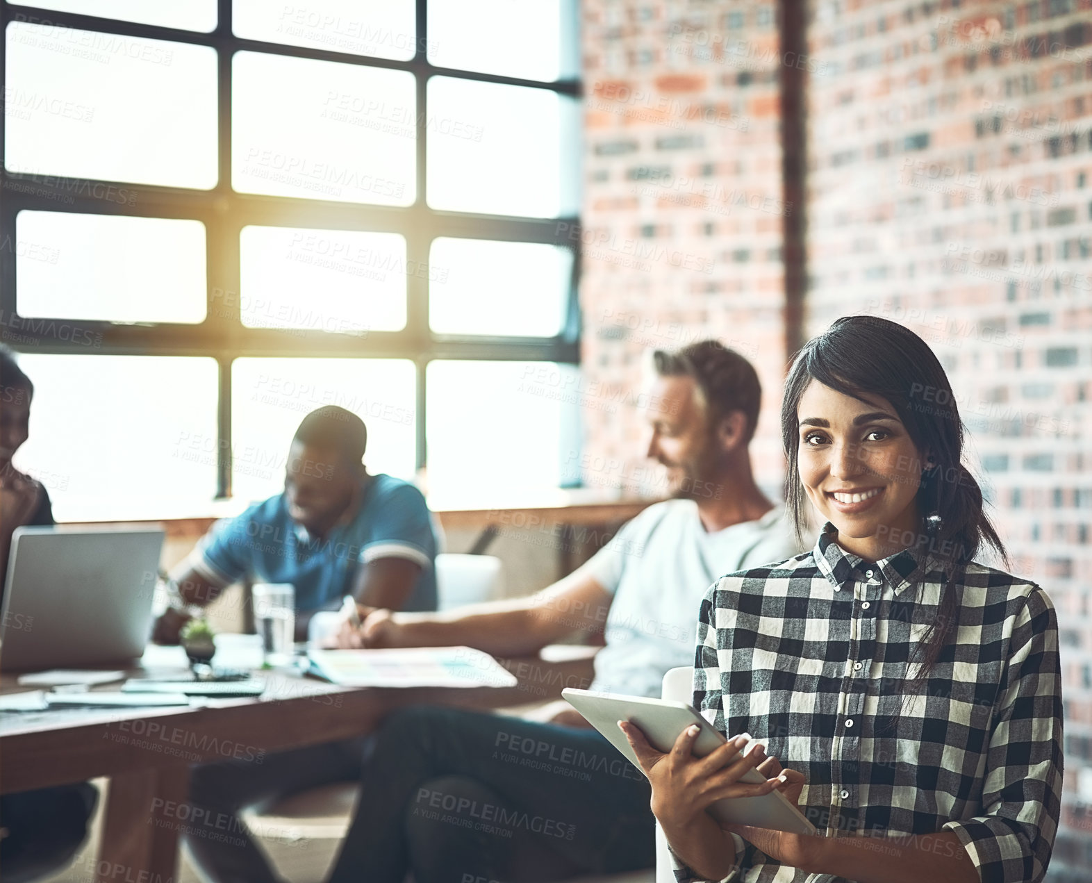 Buy stock photo Shot of a team of entrepreneurs collaborating in a modern office 