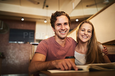 Buy stock photo Portrait of a happy young student couple studying together at a cafe