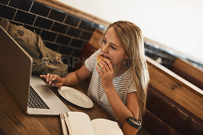 Buy stock photo Studying, student and girl in cafe, eating and typing of project with laptop, online course and education with web. Digital, college and reading of notes for exam, computer and person with textbook