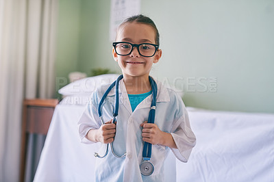 Buy stock photo Girl child, portrait and playing doctor with smile, glasses and holding stethoscope in home, hospital or clinic. Female kid, play medic and happy with excited face, learning and game for development