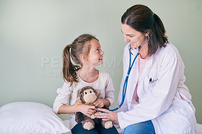 Buy stock photo Medical, kids and a girl at a woman pediatrician for an appointment or checkup in the hospital. Healthcare, stethoscope and teddy bear with an adorable female child sitting on a bed in the clinic