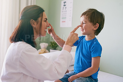 Buy stock photo Woman doctor, playing and child fun at a hospital for healthcare and medical consultation. Smile, trust and pediatrician touch nose with a laugh and happiness in a clinic with boy patient with exam