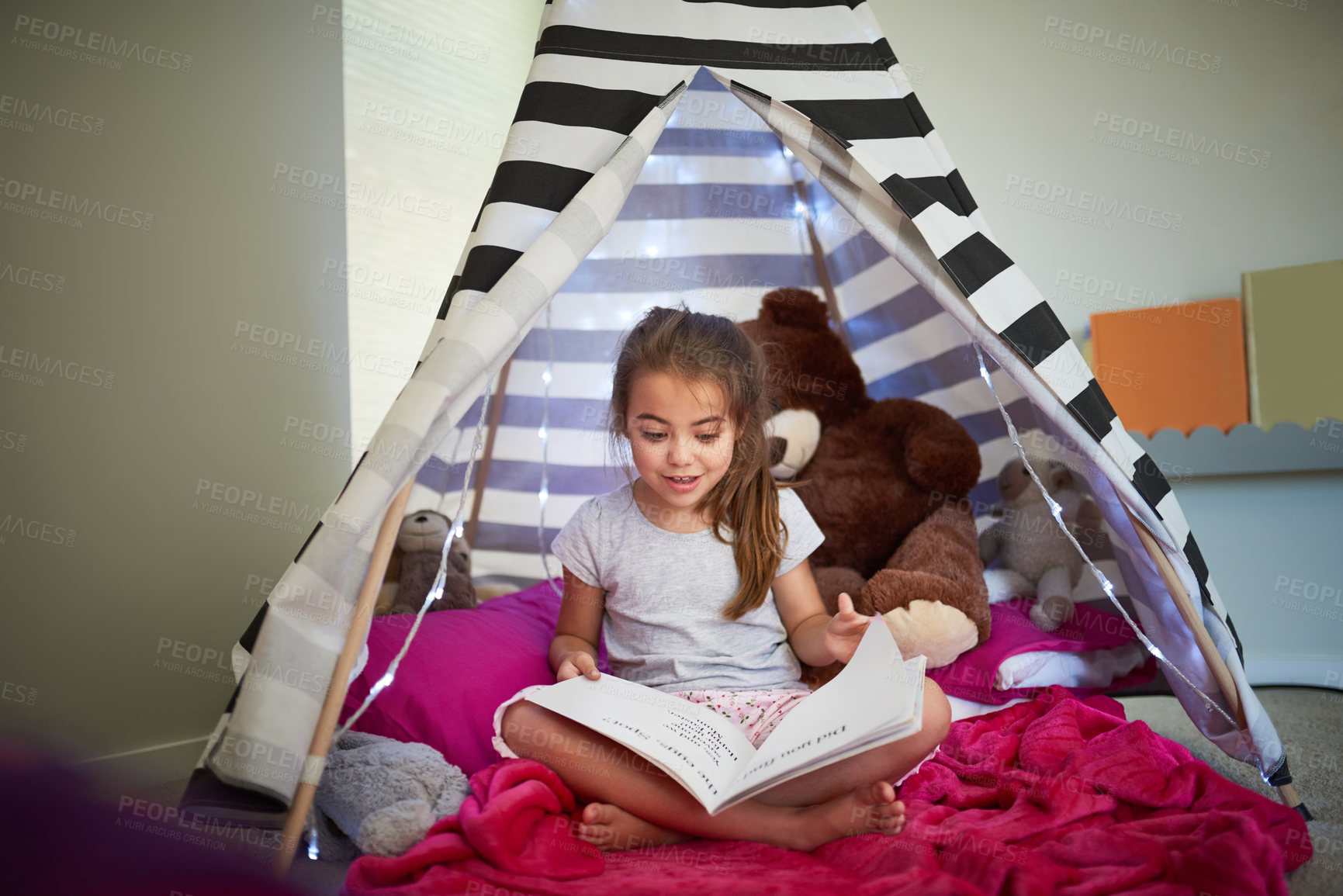 Buy stock photo Learning, kid and reading book in home tent for education, development or creative knowledge in bedroom. Girl child, fairytale or studying fantasy story, information or hobby with teddy bear to relax