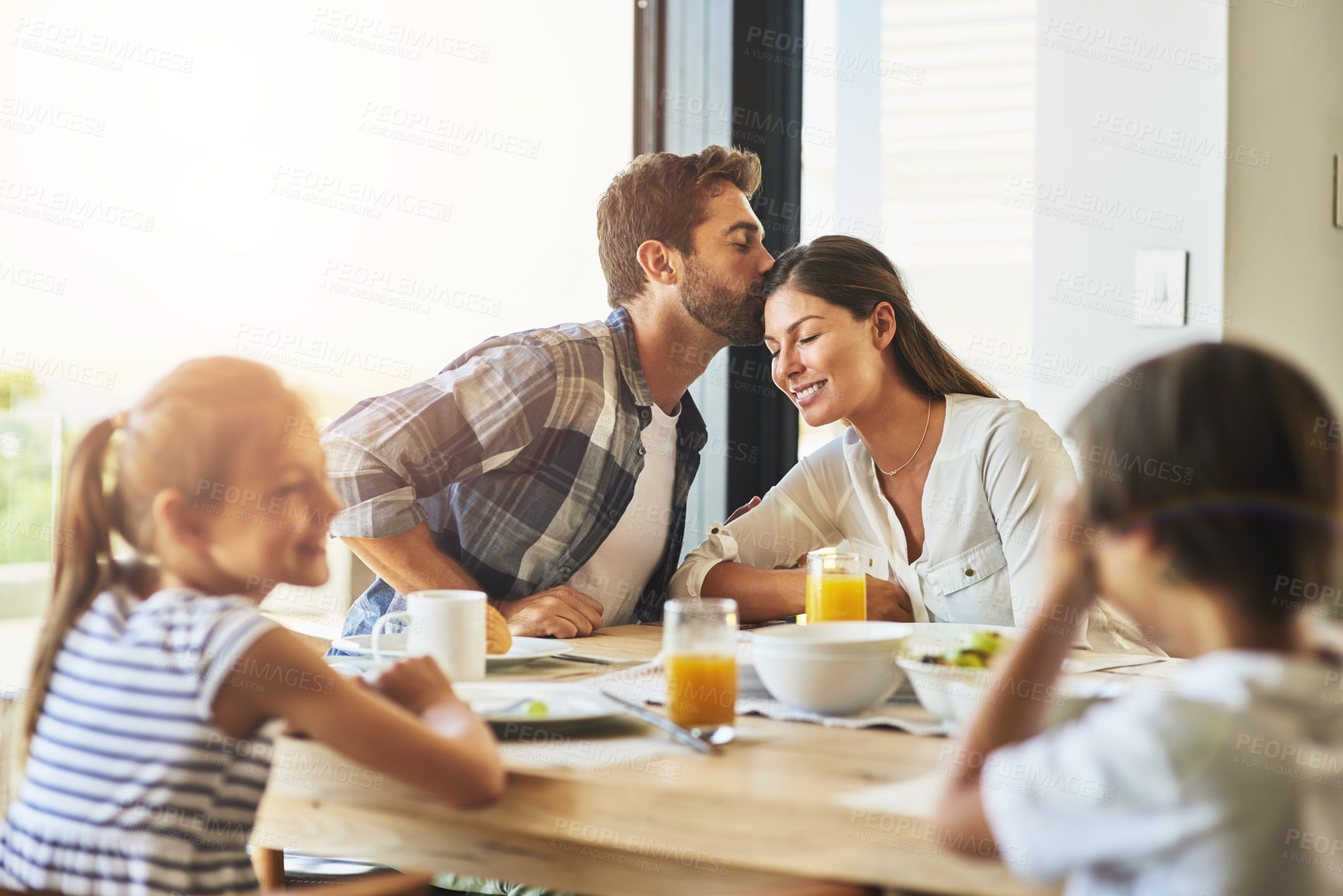 Buy stock photo Shot of a family having breakfast together at home