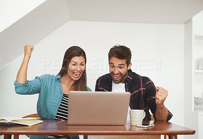 Buy stock photo Shot of a couple of happy entrepreneurs celebrating an achievement in their home office