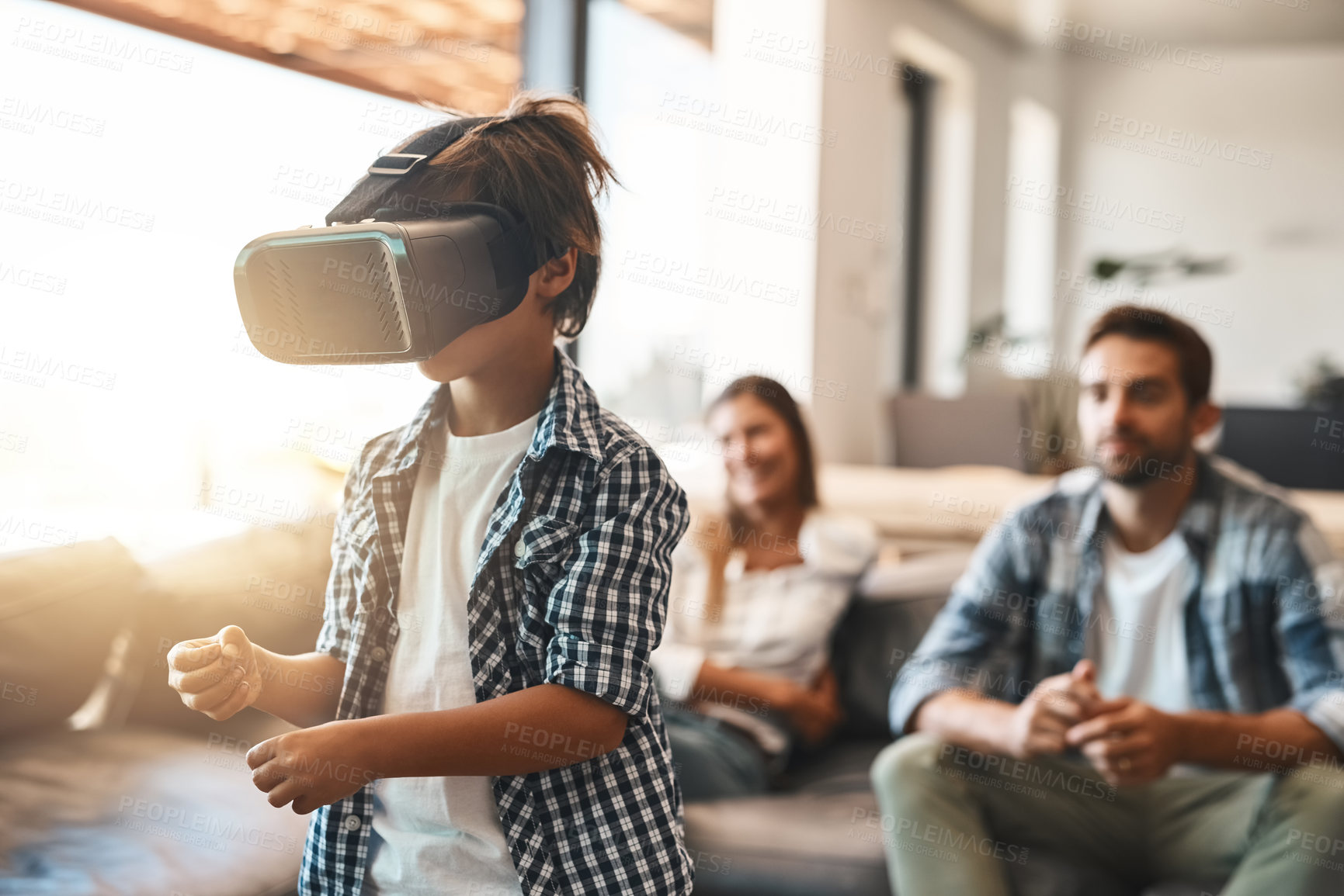 Buy stock photo Parents, child and virtual reality headset in home or cyber experience, metaverse system or gaming connection. 
Gamer family, boy and VR games in living room with future, digital world and technology