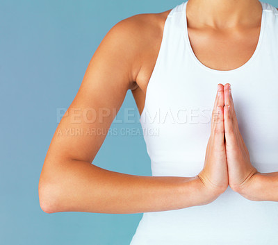 Buy stock photo Hands, woman and meditation with praying and yoga, spiritual and healing with fitness isolated on blue background. Peace, zen and mindfulness, female yogi meditate in studio with closeup and namaste