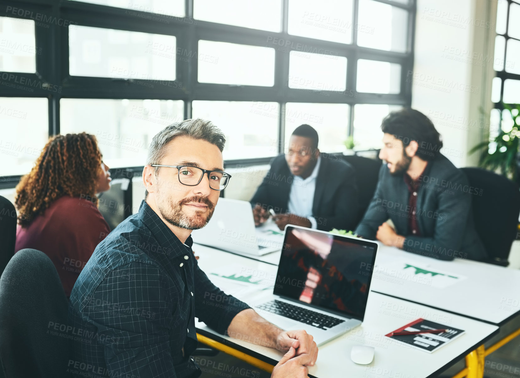 Buy stock photo Office, glasses and portrait of man, laptop and review of paperwork in meeting and project. Screen, web designer and diversity of teamwork, creative and people in collaboration, online and woman