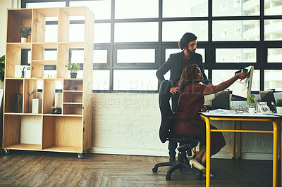Buy stock photo Cropped shot of a young businessman helping a female coworker in their office