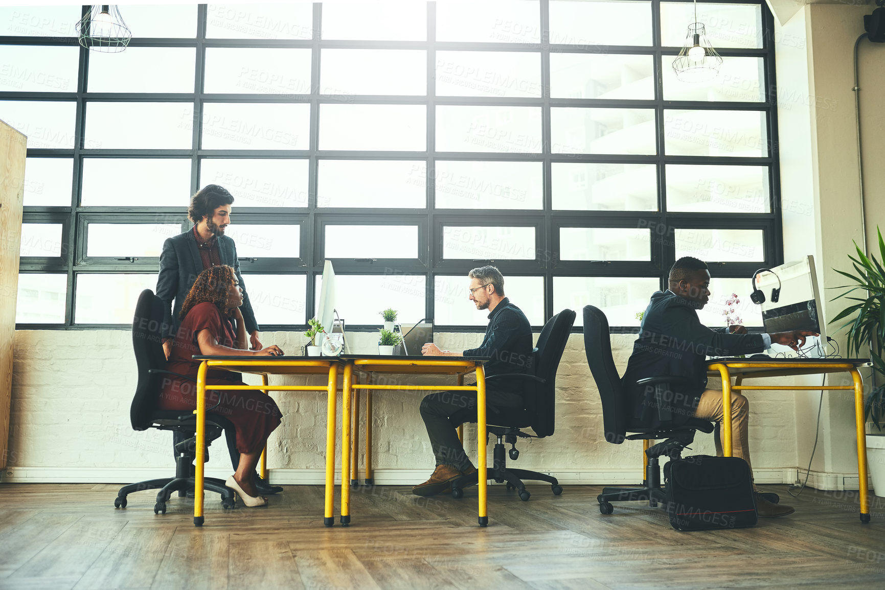 Buy stock photo Full length shot of a group of businesspeople working in their office