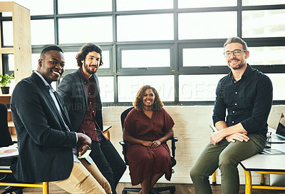 Buy stock photo Cropped portrait of a group of businesspeople sitting in their office
