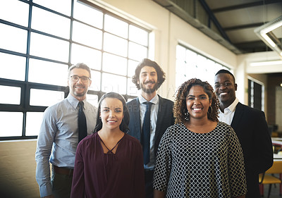 Buy stock photo Portrait of a diverse team of happy businesspeople posing together in their office