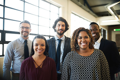 Buy stock photo Portrait of a diverse team of happy businesspeople posing together in their office