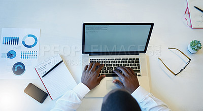 Buy stock photo High angle shot of a businessman working on a laptop in an office
