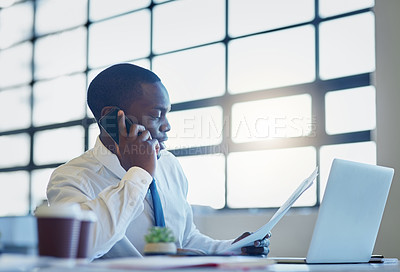 Buy stock photo Shot of a businessman talking on a cellphone in an office