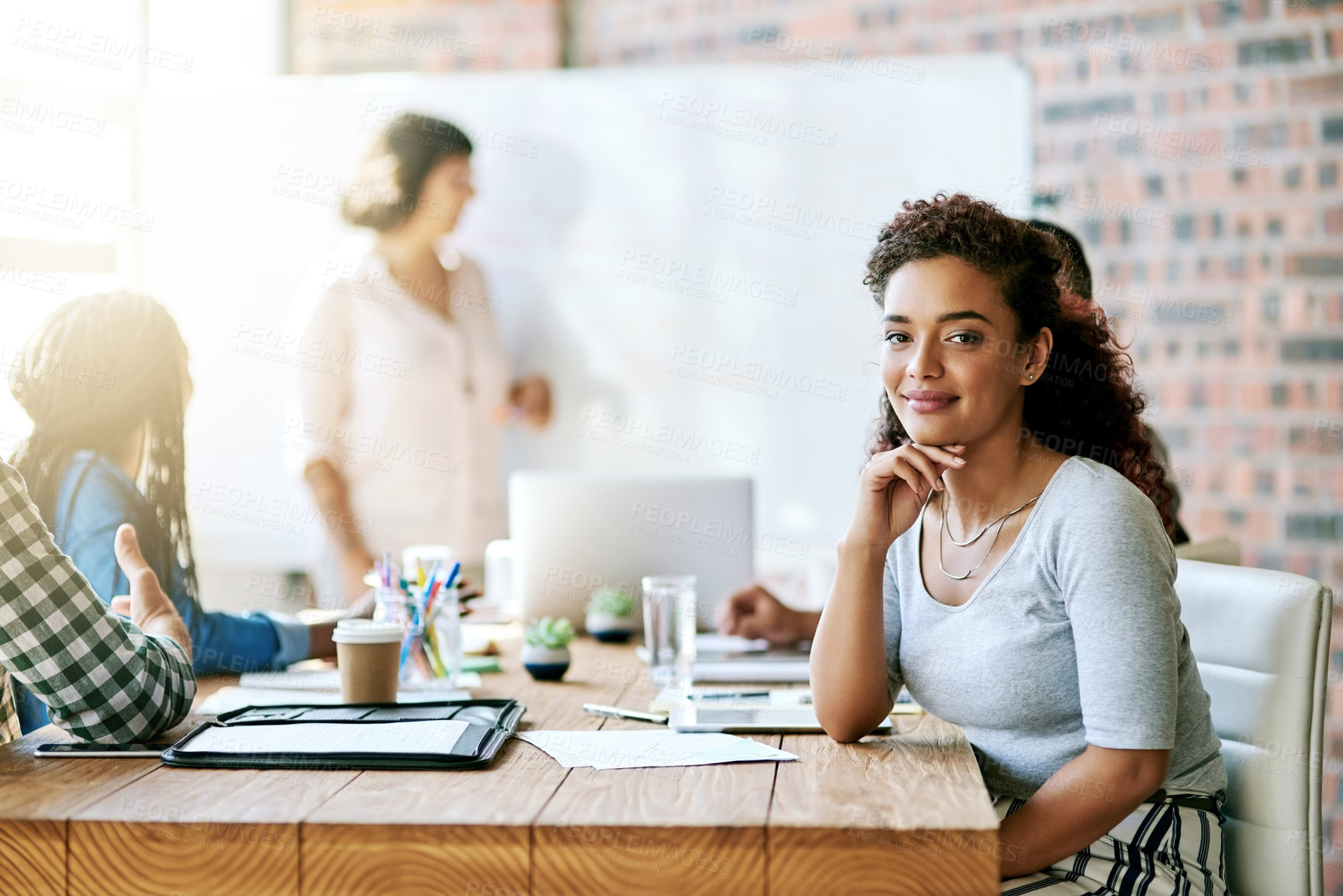 Buy stock photo Business, presentation and portrait of girl in office with documents for teamwork, planning or idea inspiration. Meeting, face or accounting intern with group of people for sales, profit or feedback