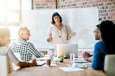 Buy stock photo Shot of a businesswoman giving a presentation in the boardroom