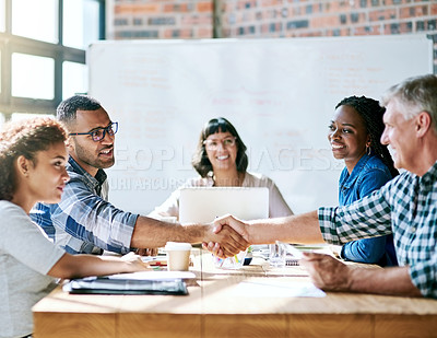 Buy stock photo Shot of a team of entrepreneurs collaborating in a modern office 