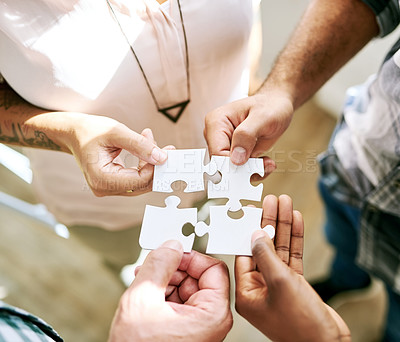 Buy stock photo Hands, teamwork and jigsaw for strategy, solution and circle with collaboration for creativity at startup. People, group and scrum with puzzle for problem solving, help and above for synergy at job