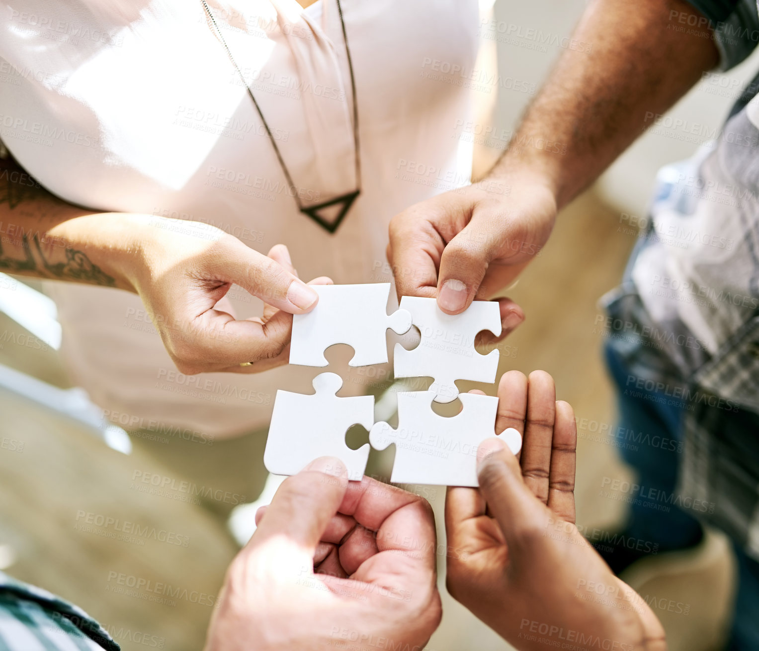 Buy stock photo Hands, teamwork and jigsaw for strategy, solution and circle with collaboration for creativity at startup. People, group and scrum with puzzle for problem solving, help and above for synergy at job