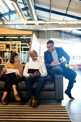 Buy stock photo Business people, talking and relax on couch in office with ceo for monthly meeting, project updates or conversation. Boss, graphic designer team and communication for creative brief and feedback.