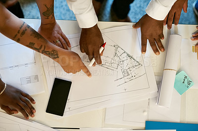 Buy stock photo Cropped shot of a group of architects collaborating on a project